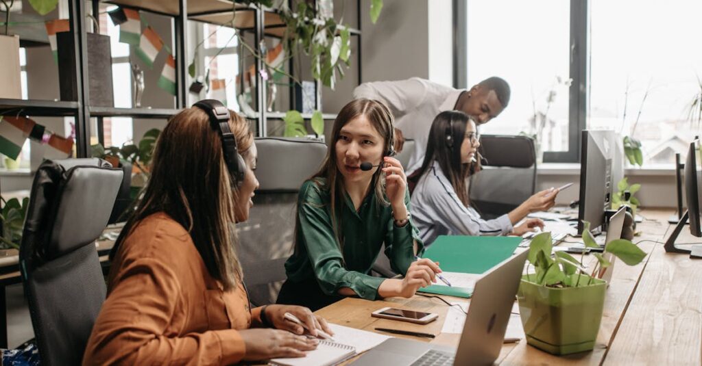 Employees working together in a modern call center environment highlighting teamwork and diversity.